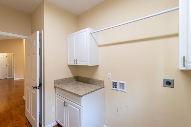 924 Brookside Ln, Rolla, MO 65401 - laundry area featuring electric dryer hookup, wood finished floors, hookup for a washing machine, and cabinet space