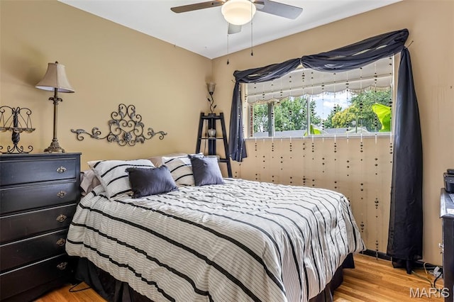 5 Heathwood Ln, Fenton, MO 63026 - bedroom with light wood finished floors and ceiling fan
