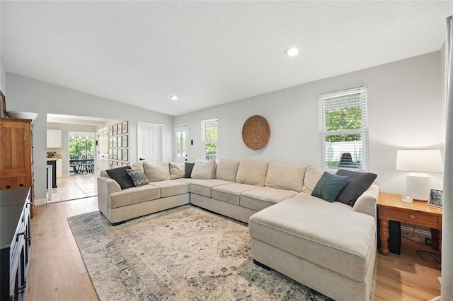 636 Parker Dr, Ballwin, MO 63021 - living area with plenty of natural light, light wood-style flooring, recessed lighting, and a textured ceiling