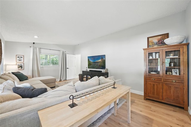636 Parker Dr, Ballwin, MO 63021 - living area with light wood-style floors, recessed lighting, and baseboards