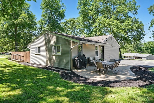 636 Parker Dr, Ballwin, MO 63021 - back of property with a patio area, a yard, and a chimney