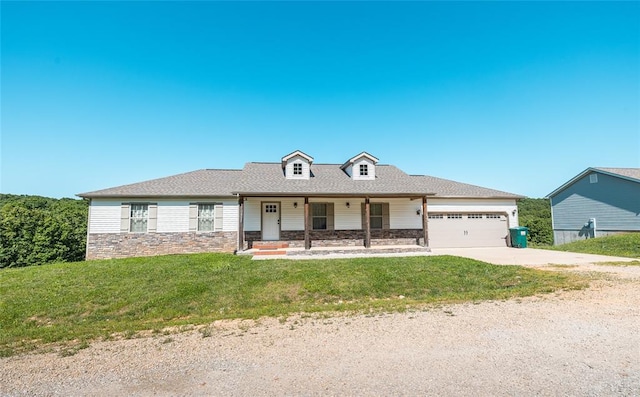 20998 Halifax Dr, Saint Robert, MO 65584 - view of front of home with stone siding, an attached garage, covered porch, and a front yard
