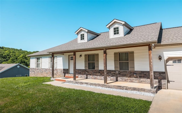 20998 Halifax Dr, Saint Robert, MO 65584 - view of front facade featuring a porch, a front lawn, roof with shingles, stone siding, and an attached garage