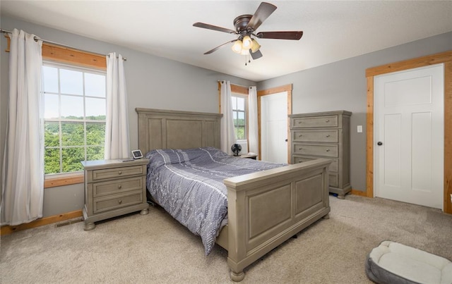 20998 Halifax Dr, Saint Robert, MO 65584 - bedroom with light colored carpet, a ceiling fan, and baseboards