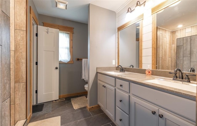 20998 Halifax Dr, Saint Robert, MO 65584 - full bath featuring double vanity, toilet, tile patterned flooring, and baseboards