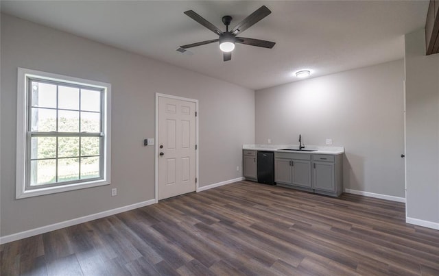 20998 Halifax Dr, Saint Robert, MO 65584 - bar featuring a sink, a ceiling fan, dark wood-style floors, baseboards, and dishwasher