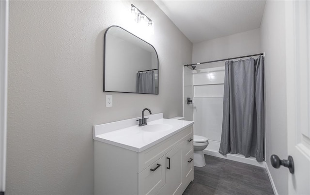 20998 Halifax Dr, Saint Robert, MO 65584 - full bath featuring vanity, toilet, wood finished floors, and baseboards