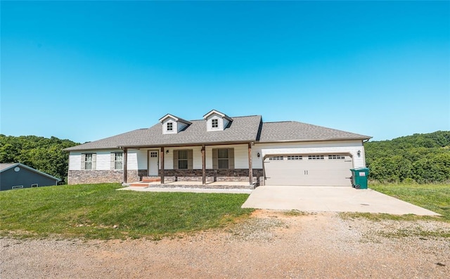 20998 Halifax Dr, Saint Robert, MO 65584 - view of front of property featuring a porch, a garage, a front lawn, driveway, and stone siding