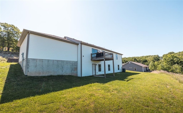 20998 Halifax Dr, Saint Robert, MO 65584 - back of property with a lawn and a deck