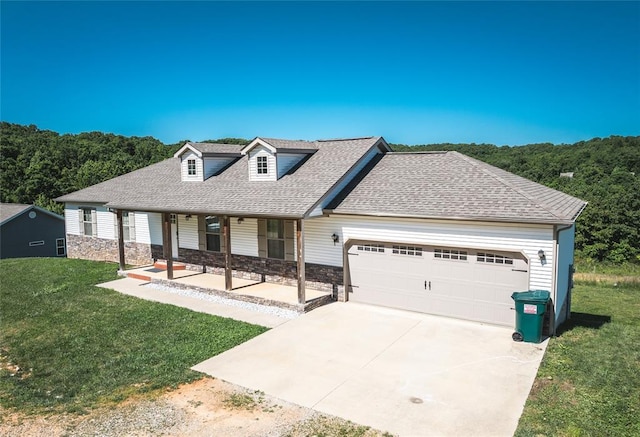 20998 Halifax Dr, Saint Robert, MO 65584 - view of front facade featuring covered porch, a garage, a front yard, and driveway