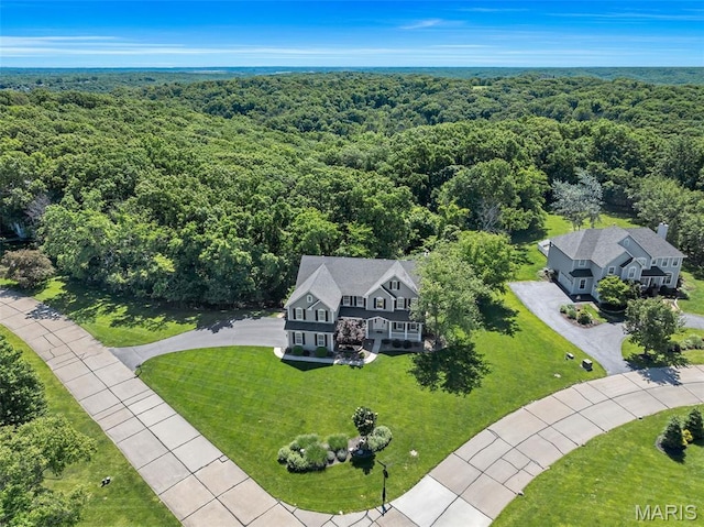 943 Sheffield Forest Ct, Saint Louis, MO 63021 - aerial view of property and surrounding area with a heavily wooded area