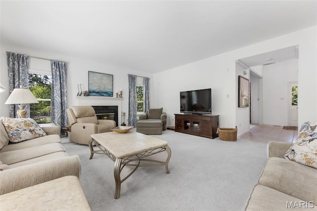 943 Sheffield Forest Ct, Saint Louis, MO 63021 - living area with plenty of natural light, light carpet, and a glass covered fireplace