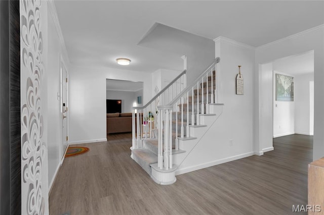 16027 Clarkson Woods Dr, Chesterfield, MO 63017 - foyer featuring wood finished floors, stairway, and ornamental molding