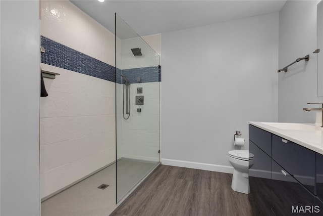 16027 Clarkson Woods Dr, Chesterfield, MO 63017 - full bathroom with wood finished floors, a walk in shower, and vanity