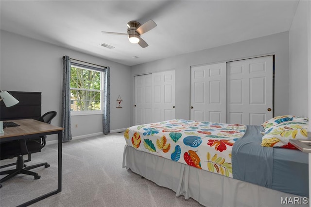 16027 Clarkson Woods Dr, Chesterfield, MO 63017 - carpeted bedroom featuring multiple closets, an office area, and a ceiling fan