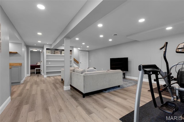 16027 Clarkson Woods Dr, Chesterfield, MO 63017 - living area featuring light wood-type flooring, recessed lighting, and stairway