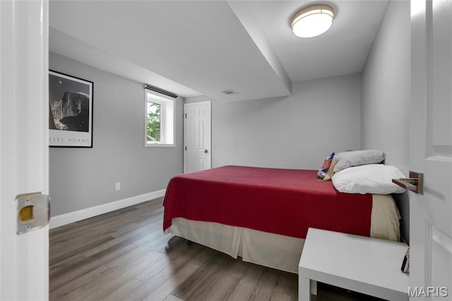 16027 Clarkson Woods Dr, Chesterfield, MO 63017 - bedroom featuring wood finished floors and baseboards