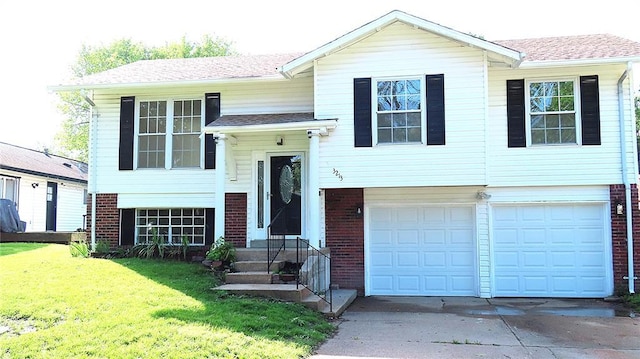 3213 Yvette Ct, Florissant, MO 63031 - raised ranch featuring brick siding, concrete driveway, a front lawn, an attached garage, and a shingled roof