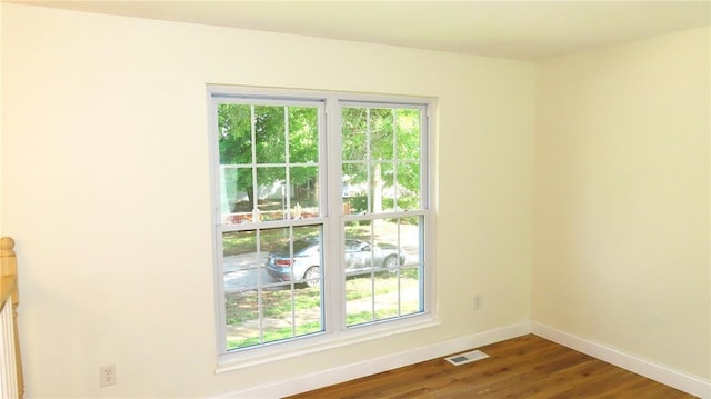 3213 Yvette Ct, Florissant, MO 63031 - spare room featuring baseboards and wood finished floors