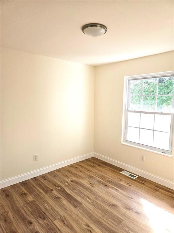 3213 Yvette Ct, Florissant, MO 63031 - spare room with baseboards and wood finished floors