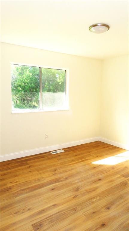 3213 Yvette Ct, Florissant, MO 63031 - unfurnished room featuring baseboards and light wood-style floors
