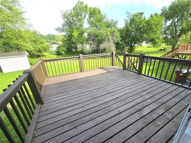 3213 Yvette Ct, Florissant, MO 63031 - wooden terrace featuring a yard and an outdoor structure