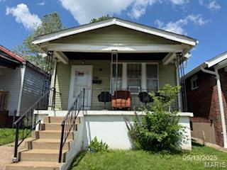 5955 Harney, Saint Louis, MO 63135 - shotgun-style home with covered porch and stairway