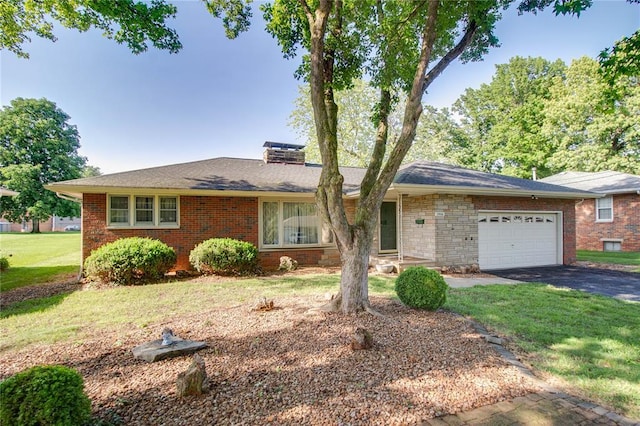 3406 Mcarthur Blvd, Alton, IL 62002 - ranch-style home featuring a garage, driveway, a front yard, and brick siding