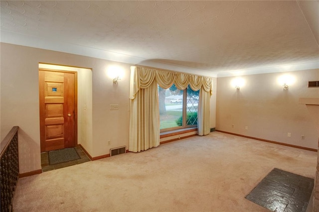 3406 Mcarthur Blvd, Alton, IL 62002 - unfurnished living room with carpet flooring, baseboards, a textured ceiling, and crown molding