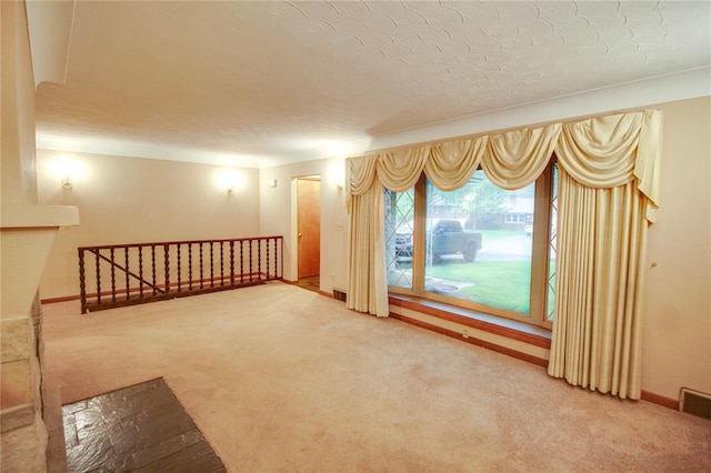 3406 Mcarthur Blvd, Alton, IL 62002 - spare room with carpet floors, a textured ceiling, and baseboards