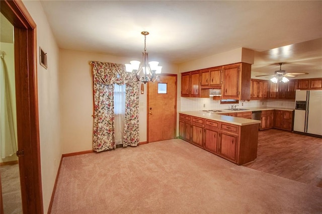 3406 Mcarthur Blvd, Alton, IL 62002 - kitchen with white appliances, brown cabinets, a peninsula, and light countertops