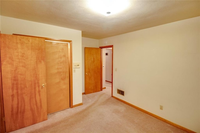 3406 Mcarthur Blvd, Alton, IL 62002 - unfurnished bedroom featuring light colored carpet, a closet, and baseboards