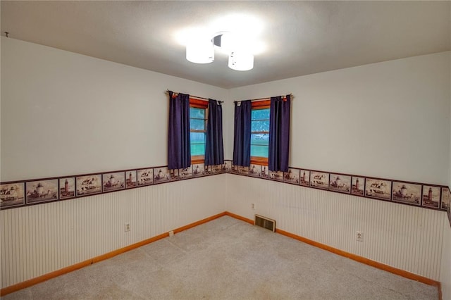 3406 Mcarthur Blvd, Alton, IL 62002 - carpeted empty room featuring a wainscoted wall and baseboards