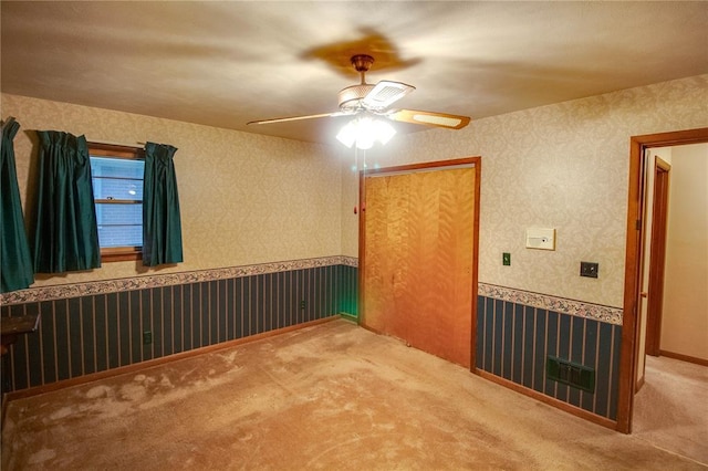 3406 Mcarthur Blvd, Alton, IL 62002 - carpeted empty room featuring ceiling fan and wallpapered walls
