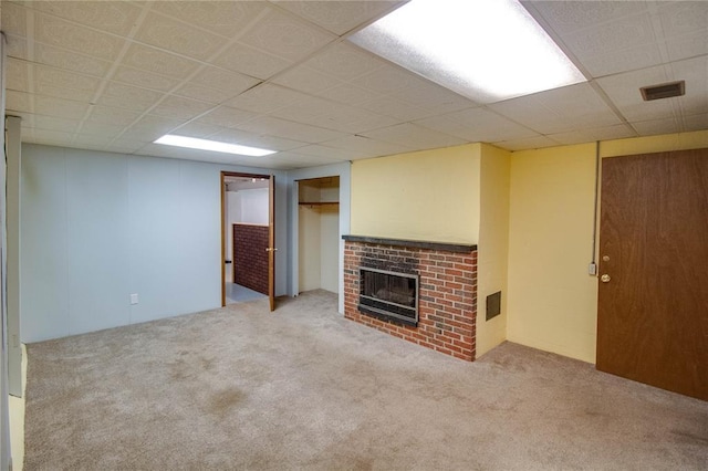 3406 Mcarthur Blvd, Alton, IL 62002 - unfurnished living room featuring carpet and a brick fireplace