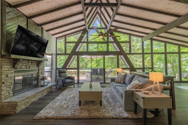 600 Innisfree Lake Dr, Innsbrook, MO 63390 - living area with high vaulted ceiling, wood ceiling with exposed beams, a fireplace, a wall of windows, and ceiling fan