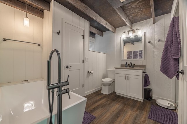 600 Innisfree Lake Dr, Innsbrook, MO 63390 - bathroom with beam ceiling, wood finished floors, toilet, a freestanding bath, and vanity
