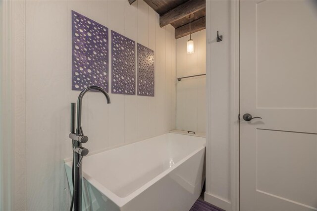 600 Innisfree Lake Dr, Innsbrook, MO 63390 - bathroom featuring beam ceiling and a tub