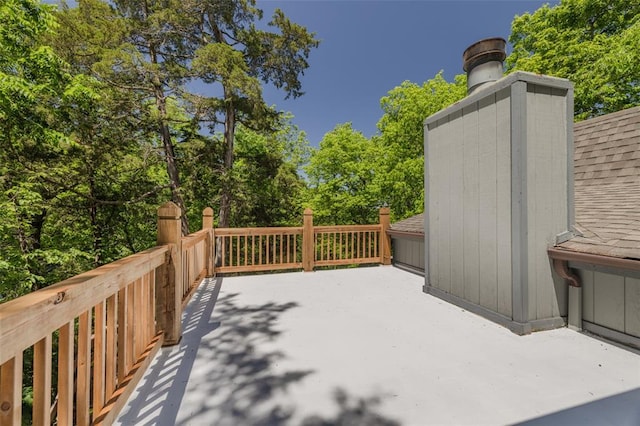 600 Innisfree Lake Dr, Innsbrook, MO 63390 - wooden deck with view of scattered trees and a patio