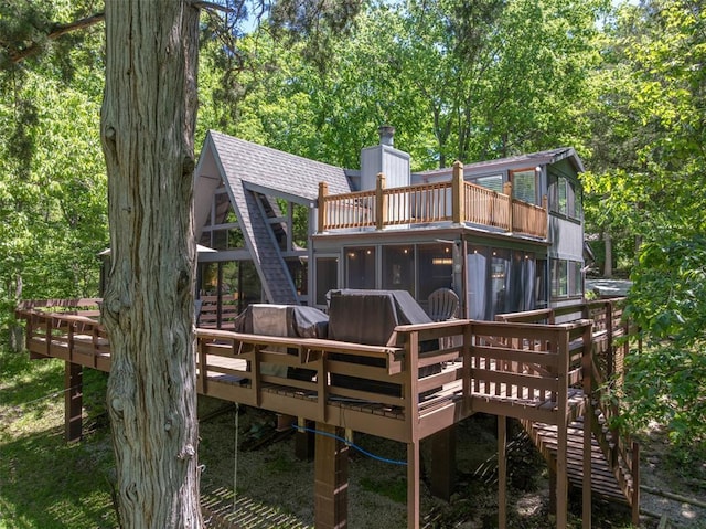 600 Innisfree Lake Dr, Innsbrook, MO 63390 - back of house with a deck, stairway, a chimney, and roof with shingles