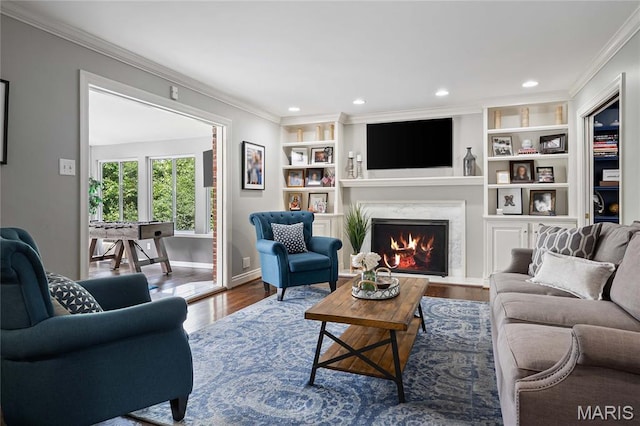 9800 Countryshire Pl, Creve Coeur, MO 63141 - living area featuring crown molding, a premium fireplace, wood finished floors, recessed lighting, and built in shelves