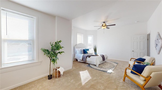 bedroom with carpet flooring, baseboards, and ceiling fan