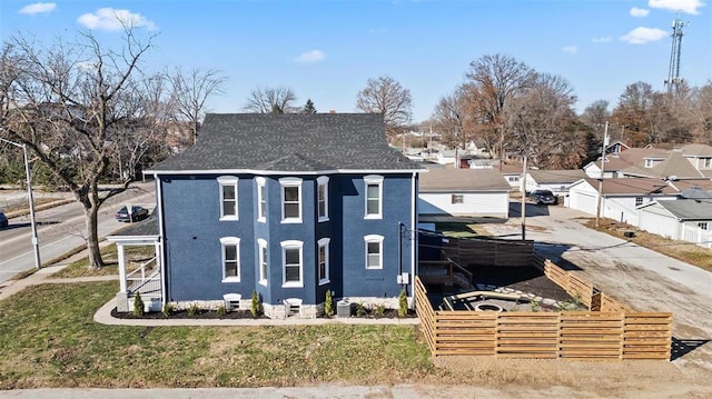 view of front of house with a shingled roof