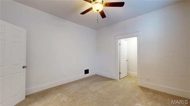 2111 W Main St, Belleville, IL 62226 - unfurnished room with light colored carpet, baseboards, and a ceiling fan