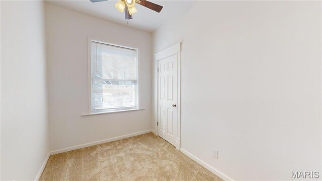 2111 W Main St, Belleville, IL 62226 - spare room featuring a ceiling fan, light carpet, and baseboards