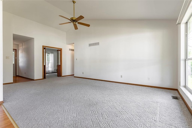 487 Prentice Dr, Ofallon, MO 63376 - empty room featuring a ceiling fan, healthy amount of natural light, light carpet, and high vaulted ceiling