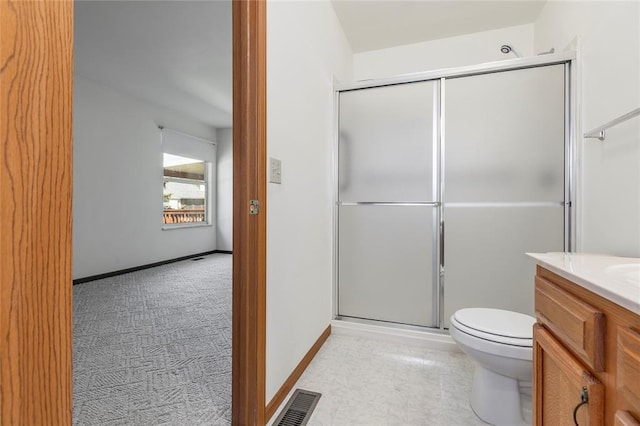 487 Prentice Dr, Ofallon, MO 63376 - bathroom with an enclosed shower, toilet, vanity, and baseboards