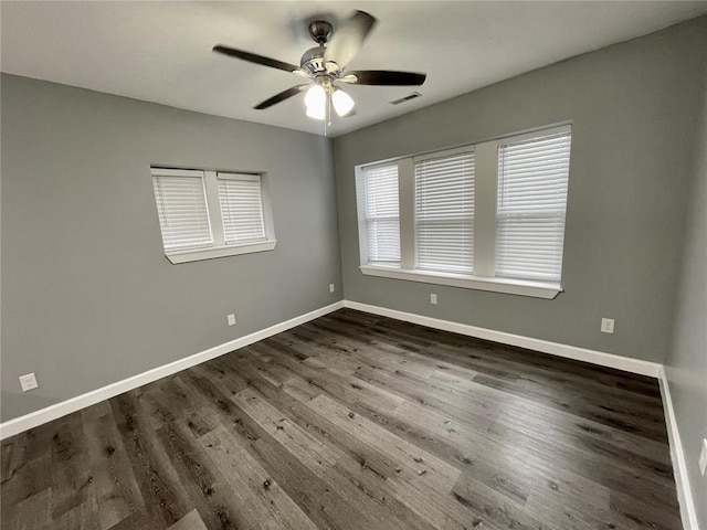 2715 Arkansas Ave, Saint Louis, MO 63118 - empty room featuring ceiling fan, baseboards, and dark wood-style flooring