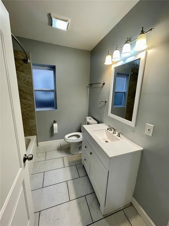 2715 Arkansas Ave, Saint Louis, MO 63118 - full bathroom featuring marble look tiles, vanity, toilet, baseboards, and  shower combination