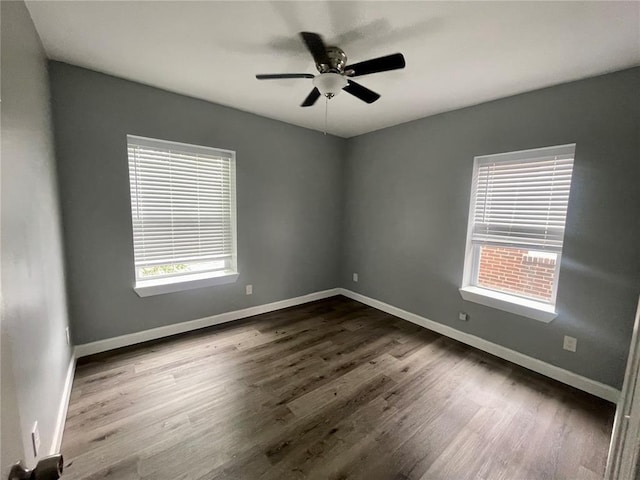 2715 Arkansas Ave, Saint Louis, MO 63118 - empty room featuring dark wood-style floors, a ceiling fan, and baseboards